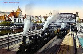 Vista de dos locomotoras de vapor saliendo de la estación central de Zúrich